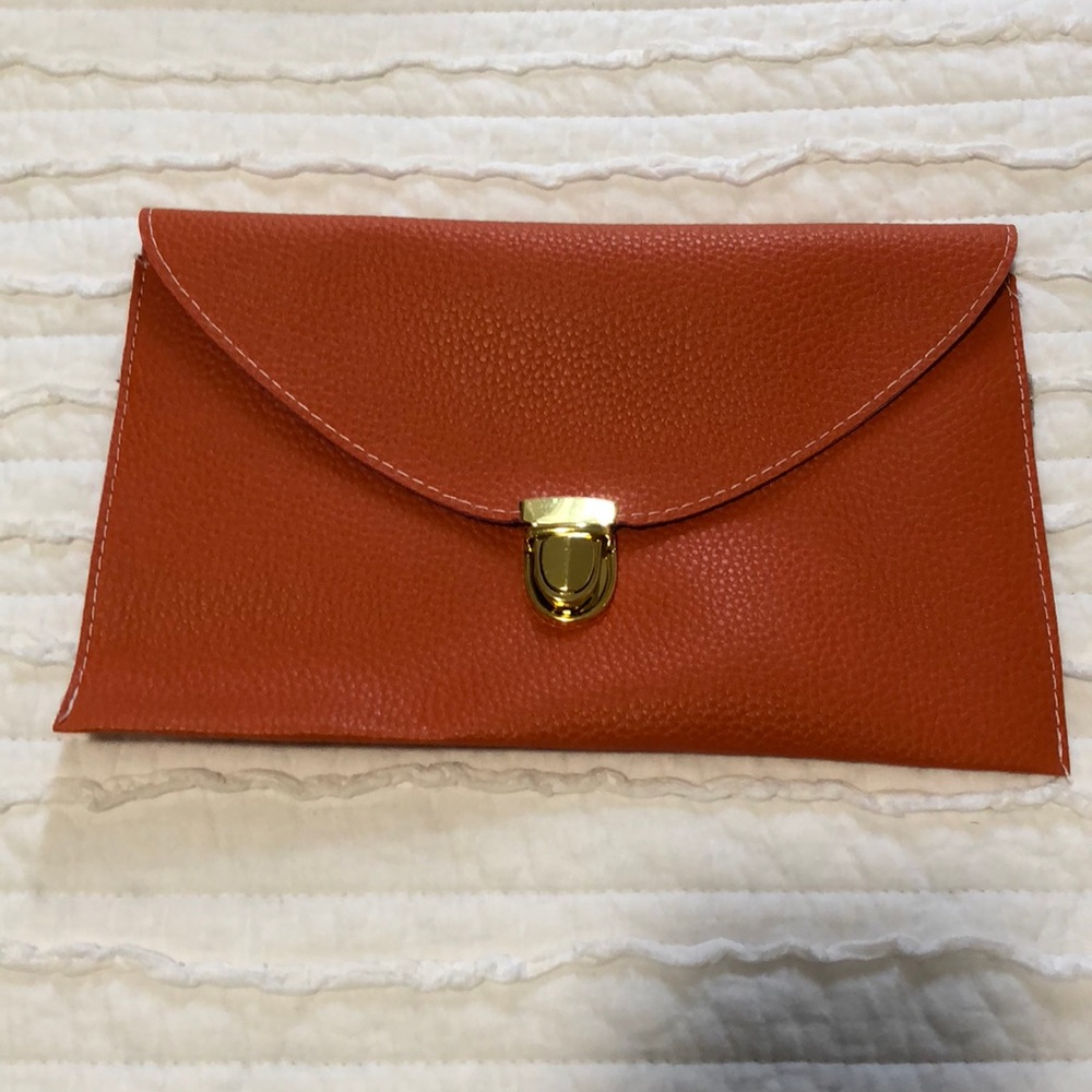 Orange envelope clutch